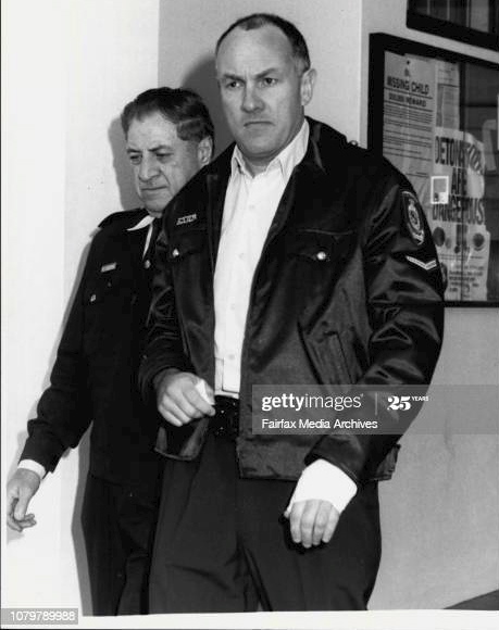 Escape.<strong>Const First Class Brian Hetherington</strong>, one hand swathed in a bandage, climbs into an ambulance taking him to Royal Prince Alfred Hospital after <strong>today's Glebe Court House escape</strong>. He had his <strong>service revolver stolen from him in</strong> the struggle. <strong>August 1, 1986</strong>. (Photo by Alan Gilbert Purcell/Fairfax Media via Getty Images).