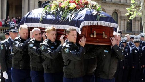 Police officers carry the coffin of Constable Bill Crews into St Andrews Cathedral in Sydney. Picture: Chris Pavlich Police officers carry the coffin of Constable Bill Crews into St Andrews Cathedral in Sydney. Picture: Chris Pavlich
