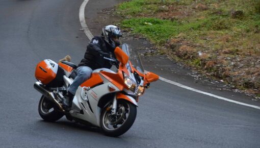 Feathers on the orange bike coming down the Barenjoey Mountain, Kangaroo Valley, NSW