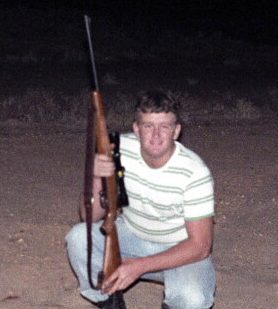Constable Steve 'Fat Attack' Webster (Fairfield Police) with a skinned Kangaroo near Bourke, N.S.W. - 1980. MARCH 1980